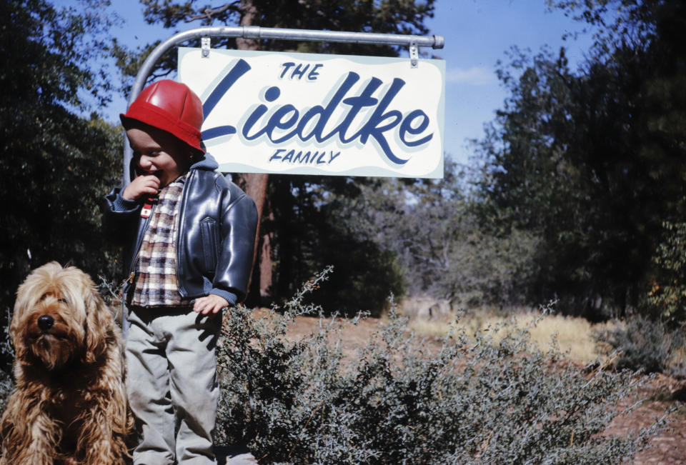 This photo provided by Michael Liedtke shows him outside a cabin in Big Bear, Calif., with his grandfather's dog, Pudge, in 1963. (James Liedtke via AP)