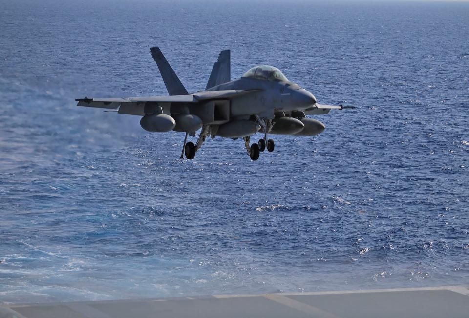 A plane prepares to land on the Navy's USS Dwight D. Eisenhower, a nuclear-powered aircraft carrier, in the Atlantic Ocean, Friday, June 30, 2023. News-Journal photographer Nadia Zomorodian recently spent 24 hours on the ship.