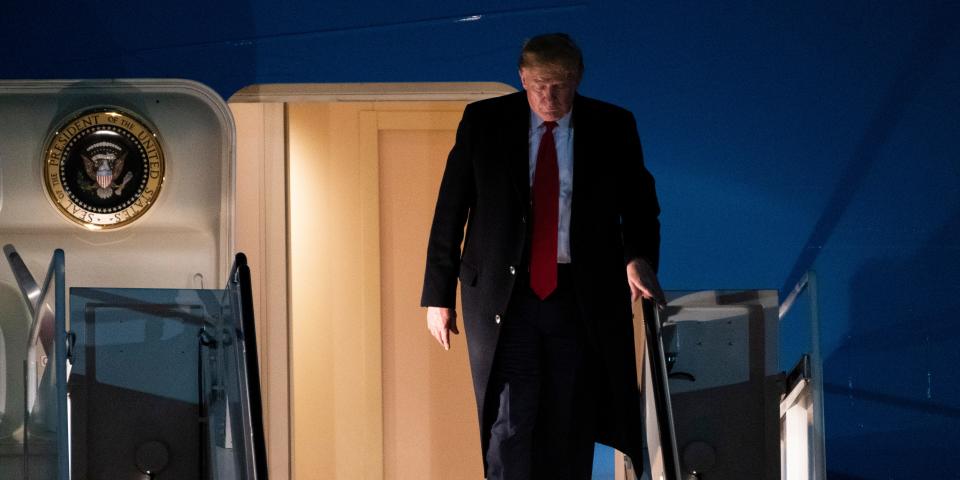 President Donald Trump exits Air Force One on Wednesday, Jan. 22, 2020, at Andrews Air Force Base, Md., after returning from the World Economic Forum in Davos, Switzerland. (AP Photo/Kevin Wolf)