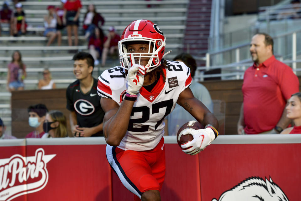 FILE - In this Saturday, Sept. 26, 2020 file photo, Georgia defensive back Eric Stokes (27) returns an interception for a touchdown against Arkansas during an NCAA college football game in Fayetteville, Ark. Daniel Jeremiah noted that Georgia teammates Tyson Campbell and Eric Stokes plus Florida State’s Asante Samuel Jr. as cornerbacks who could still be available early in the second round. The Packers could use some cornerback help and also would like to boost their depth on both sides of the line of scrimmage. (AP Photo/Michael Woods, File)