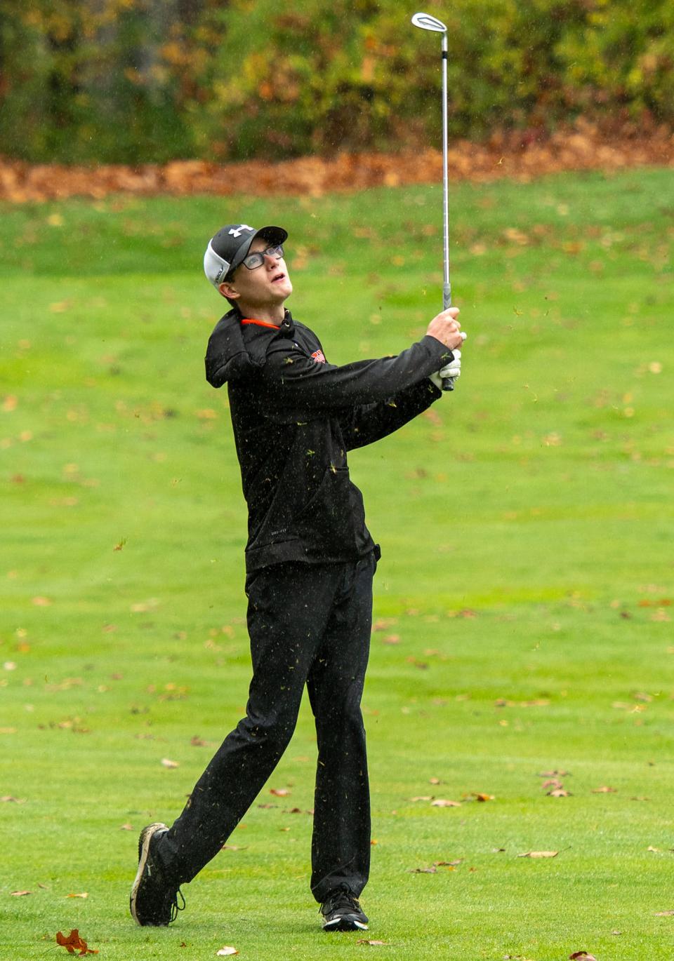Uxbridge's Cam Caso hits on the 10th fairway during the Division 3 state golf championship at Sterling National. He shot 80 to tie for fifth as an individual.