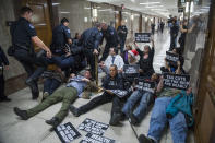 <p>Protesters disrupt the Senate Budget Committee markup of the tax reform bill in Dirksen Building on Nov. 28, 2017. (Photo: Tom Williams/CQ Roll Call/Getty Images) </p>