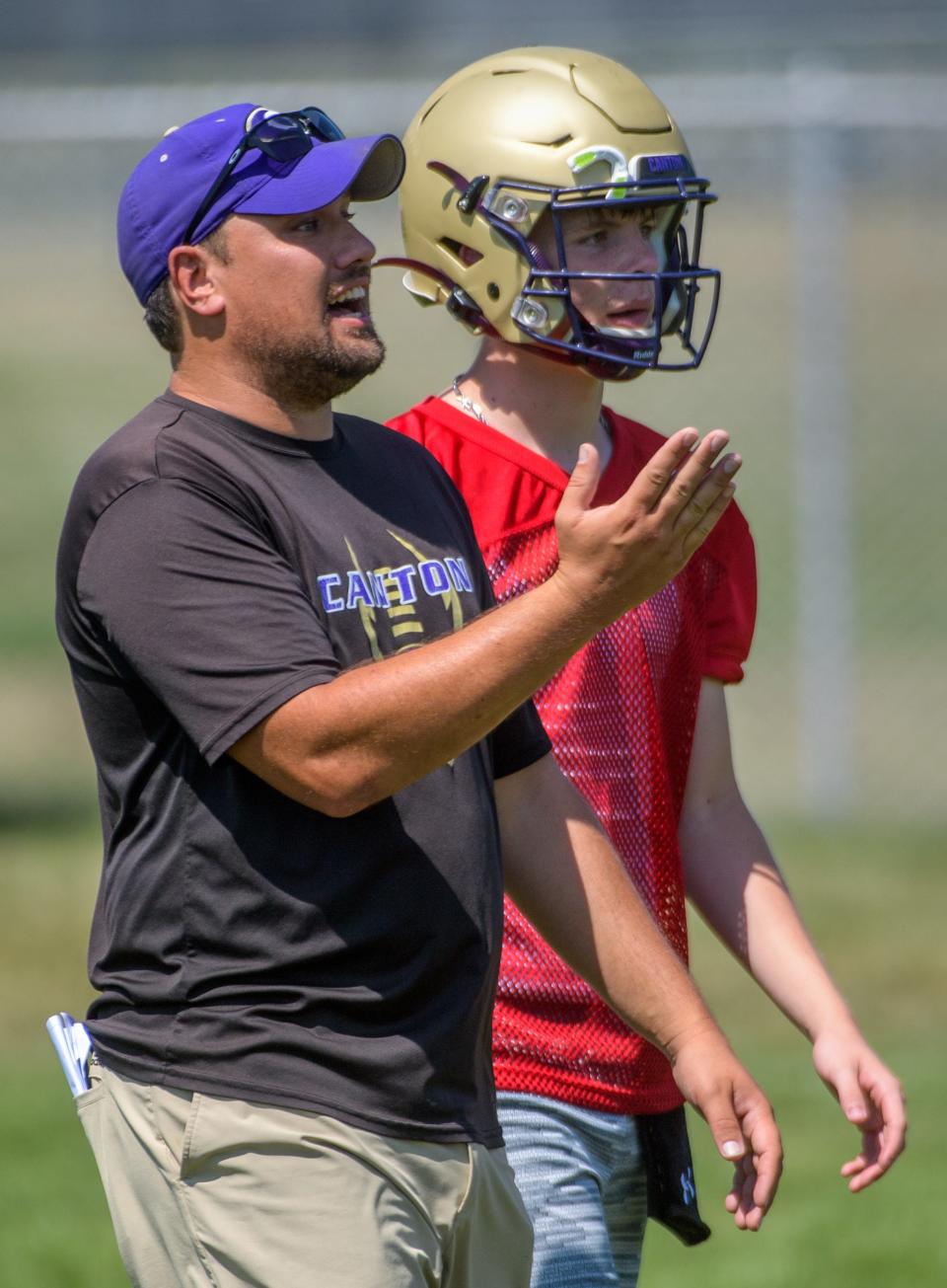 Canton High School head coach Nick Wright directs his players during the 7-on-7 football camp Saturday, July 23, 2022 at Washington Community High School.