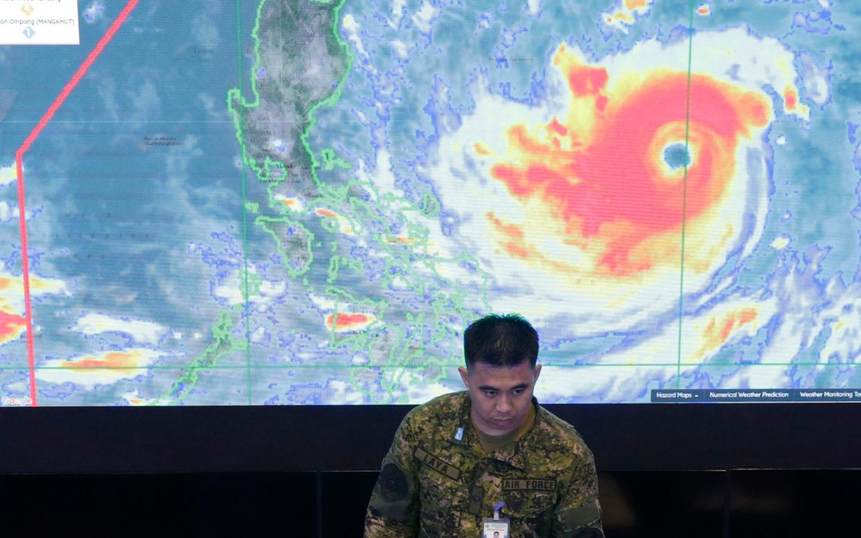 A satellite image shows Typhoon Mangkhut as officials begin evacuations  - AP