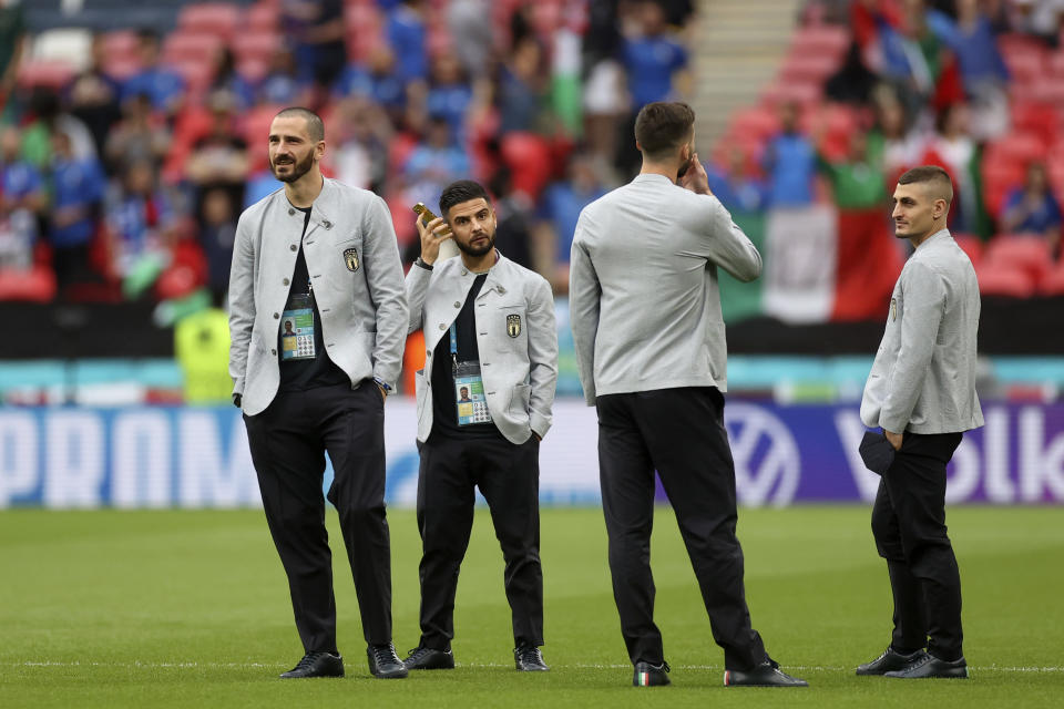 Italy players take a walk on the pitch before the Euro 2020 soccer championship final match between England and Italy at Wembley stadium in London, Sunday, July 11, 2021. (Carl Recine/Pool Photo via AP)