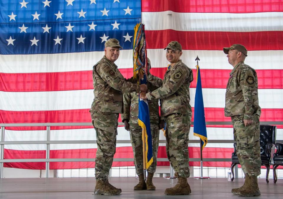 Col. Michael Alfaro, at right holding flag, took command of the 366th Fighter Wing, headquartered at Mountain Home Air Force Base, on July 18. Alfaro will oversee 5,000 airmen and 50 F-15E Strike Eagle aircraft.