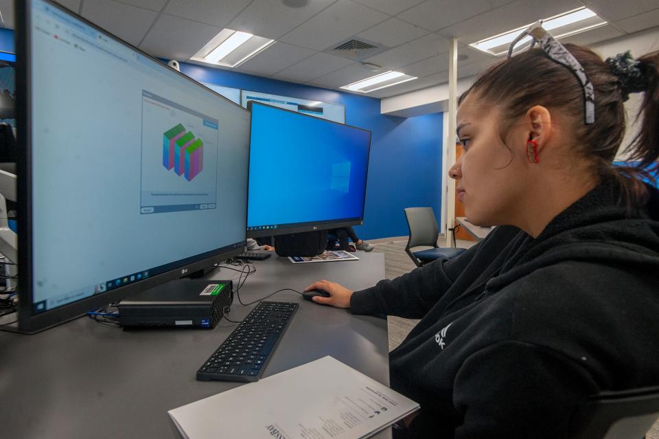Roselyn Morales, a junior at Hopkinton High School, explores cybersecurity while in the Cyber Range at MassBay Community College in Wellesley, April 3, 2024.