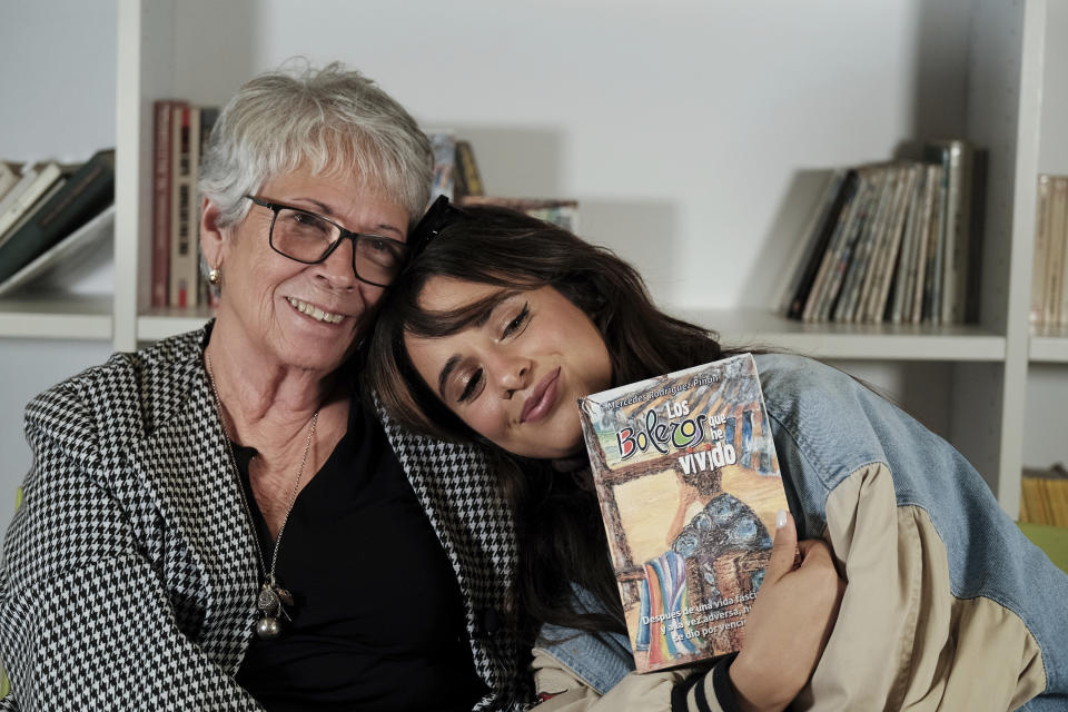 Cuban-born American singer and songwriter Camila Cabello, right, poses with her grandmother, Mercedes Rodriguez, during and interview for the Associated Press in Malaga, Spain, Thursday, March 23, 2023. When she's not singing or dancing, Cabello likes to support members of her family such as Rodriguez, who has recently published her debut novel in Spanish titled "Los boleros que he vivido". (AP Photo/Gregorio Marrero)