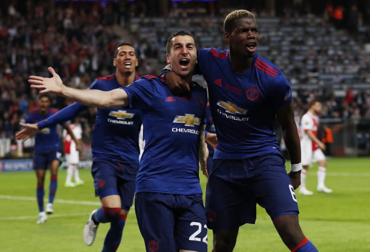 Paul Pogba and Henrikh Mkhitaryan celebrate