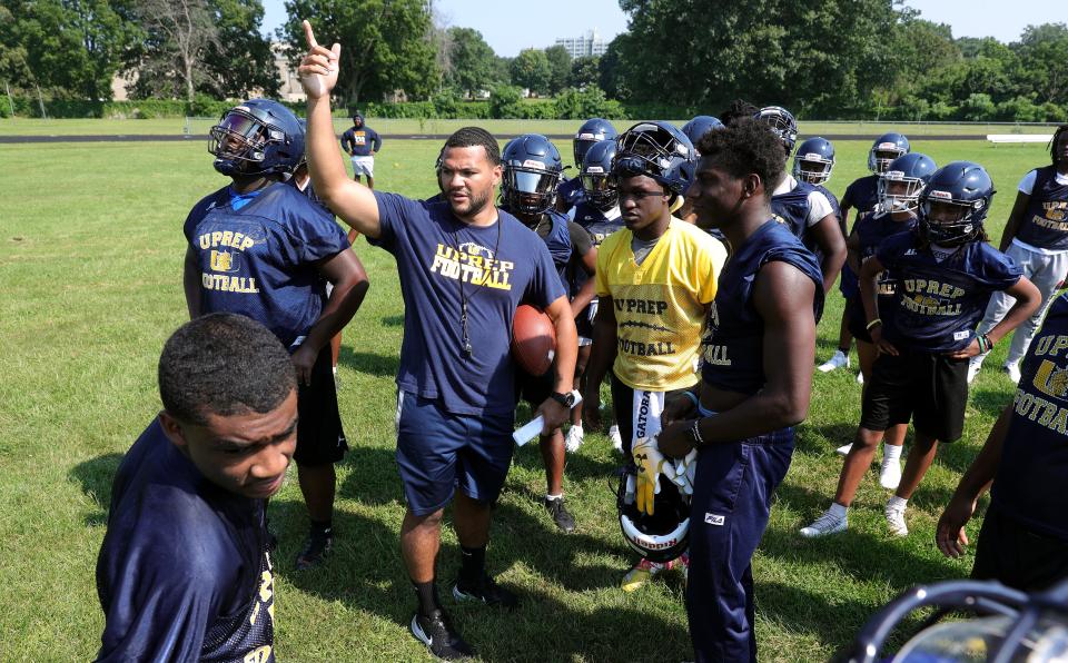 UPrep head coach Isiah Young gathers his team together at the start of the first day of practice. 