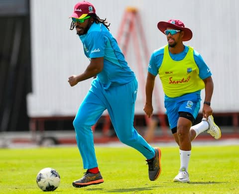 Chris Gayle (L) and Nicholas Pooran (R) of West Indies - Credit: AFP