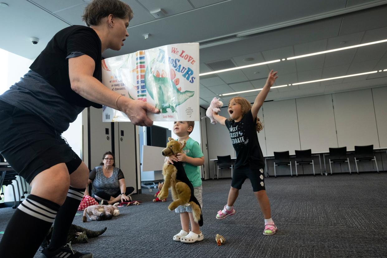 Addison Leslie, 5, right, and Grayson Hray, 2, listen as Librarian Sarah Mackey reads a book Sept. 13 during Family Story Hour at the Columbus Metropolitan Library's Gahanna Branch. The library system is seeing a property tax increase on the Nov. 7 ballot to combat rising costs, partly caused by inflation.