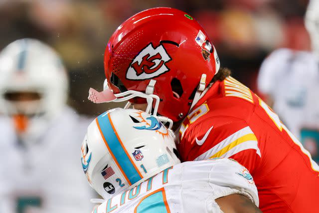 <p>Scott Winters/Icon Sportswire via Getty</p> Kansas City Chiefs quarterback Patrick Mahomes (15) helmet cracks taking a hit from Miami Dolphins safety DeShon Elliott (21) in the third quarter of an AFC Wild Card playoff game between the Miami Dolphins and Kansas City Chiefs on Jan 13, 2024