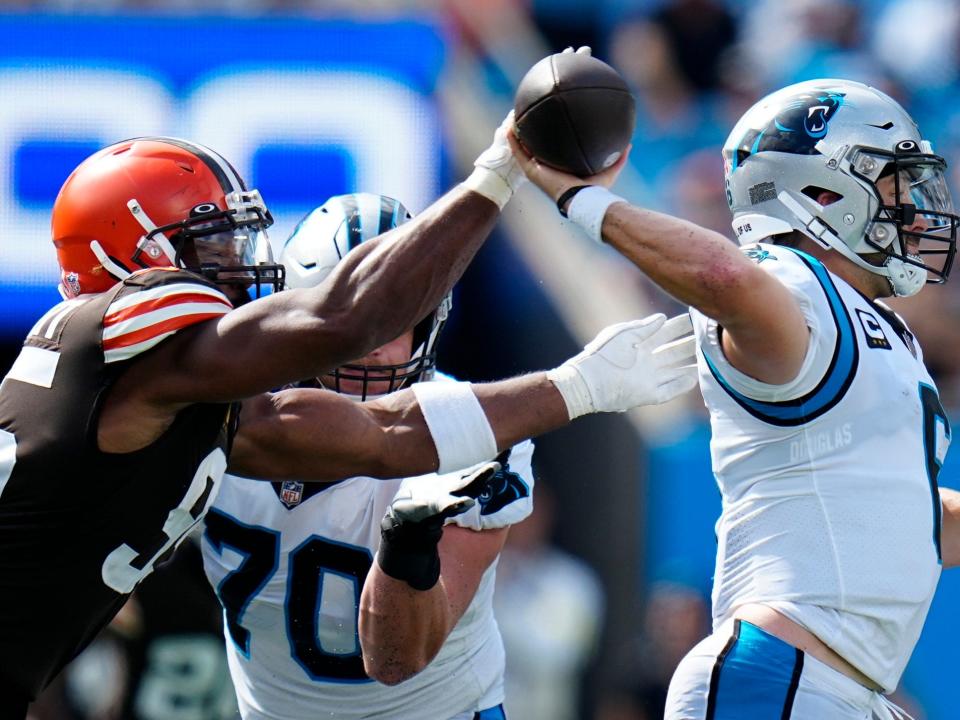 Myles Garrett pursues Baker Mayfield in the backfield.