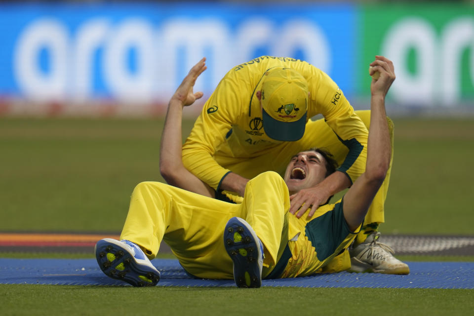 Australia's captain Pat Cummins celebrates the wicket of South Africa's wicketkeeper Quinton De Kock after taking his catch during the ICC Men's Cricket World Cup second semifinal match between Australia and South Africa in Kolkata, India, Thursday, Nov.16, 2023. (AP Photo/Aijaz Rahi)