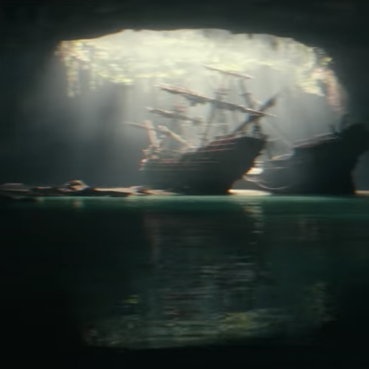 Nathan looking at a ship from a distance in the film