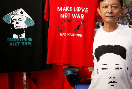 FILE PHOTO: Vietnamese shop owner Truong Thanh Duc displays t-shirts for sale with images of U.S. President Donald Trump and North Korean leader Kim Jong Un ahead of USA-DPRK Summit in Hanoi, Vietnam February 21, 2019. REUTERS/Kham/File photo