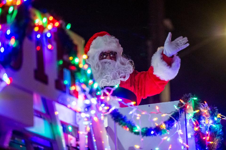 Santa Claus atop a Portsmouth fire truck as the city celebrated its tree lighting, Holiday Parade and food drive Saturday, Dec. 4, 2021.