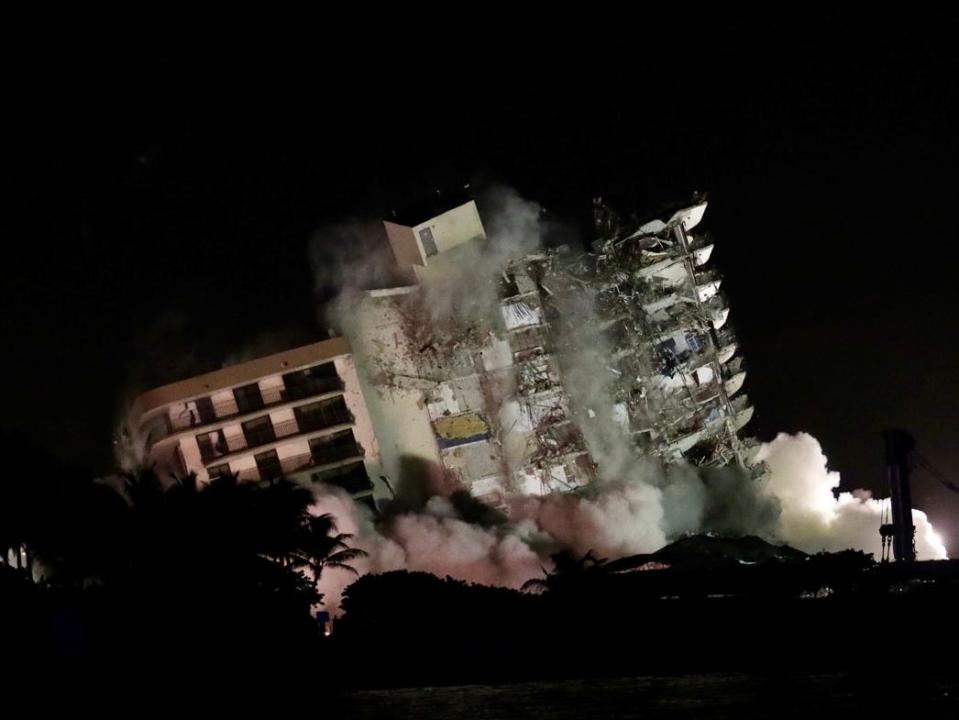 The remaining portion of the Champlain Towers South condo is leveled by controlled implosion on Sunday July 4, 2021, in Surfside, Florida. Search and Rescue crews had stopped searching until the remaining part of the building could be brought down and crews can search safely.