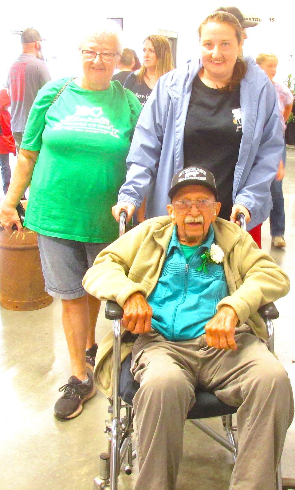 Jerry Strouse, 91, has been to a majority of the 100 Holmes County Fairs. He was recognized at the anniversary celebration Monday at the Expo Center at Harvest Ridge. His daughter Beth Crone and granddaughter Jill Hudson took Jerry for some ice cream at the fair.