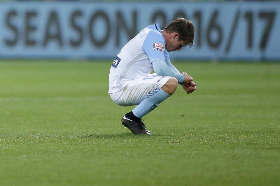 <p>Melbourne City man Nick Fitzgerald looks on bereft as City lose at home to Perth in the A League play-offs </p>