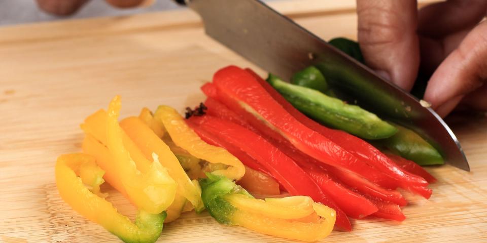 chopping peppers vegetables