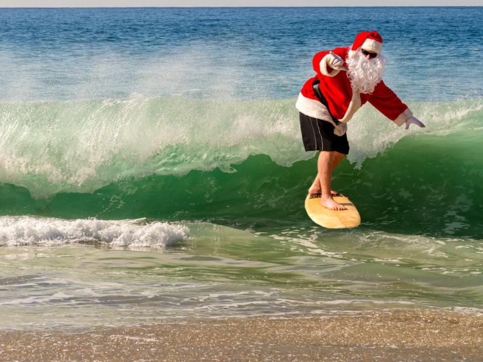 Santa rides the surf instead of a sleigh in California's Surfing Santa competition