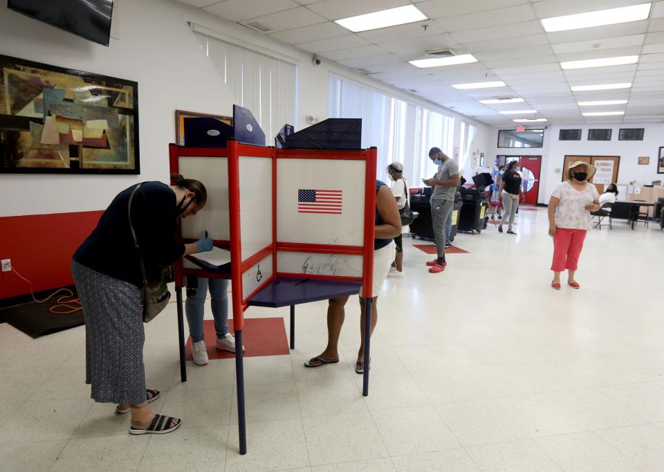 Voters cast their ballots in primary elections at the Nepperhan Community Center in Yonkers, N.Y. June 23, 2020. Despite the number of people who voted early by absentee ballot, election workers at the site said turnout was heavier than usual, which they attributed to the fact that there were fewer polling sites than usual throughout the city due to the COVID-19 pandemic. 