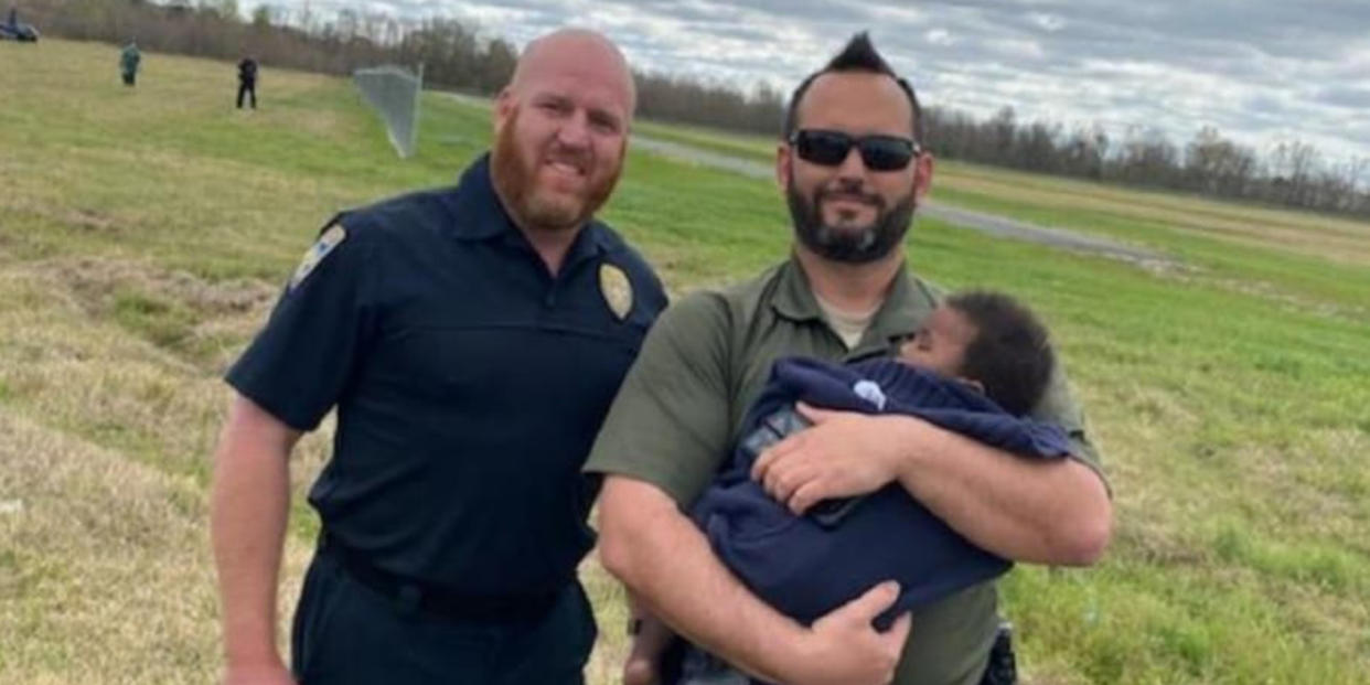 First responders with the rescued infant. (Baton Rouge Police Department via Facebook)