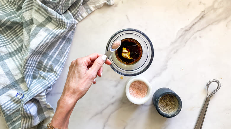 adding salt to glass bowl