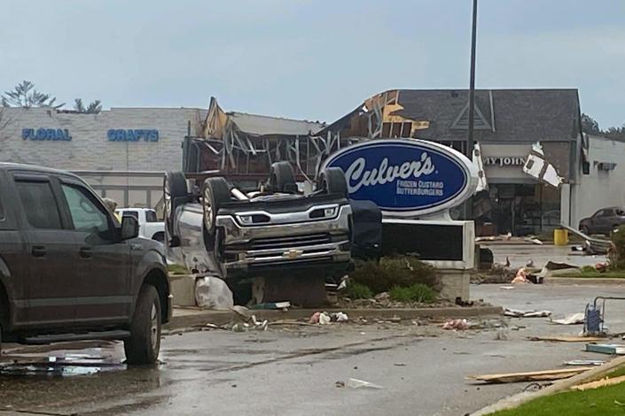 This image provided by Steven Bischer, shows an upended vehicle following an apparent tornado, Friday, May 20, 2022, in Gaylord, Mich.
