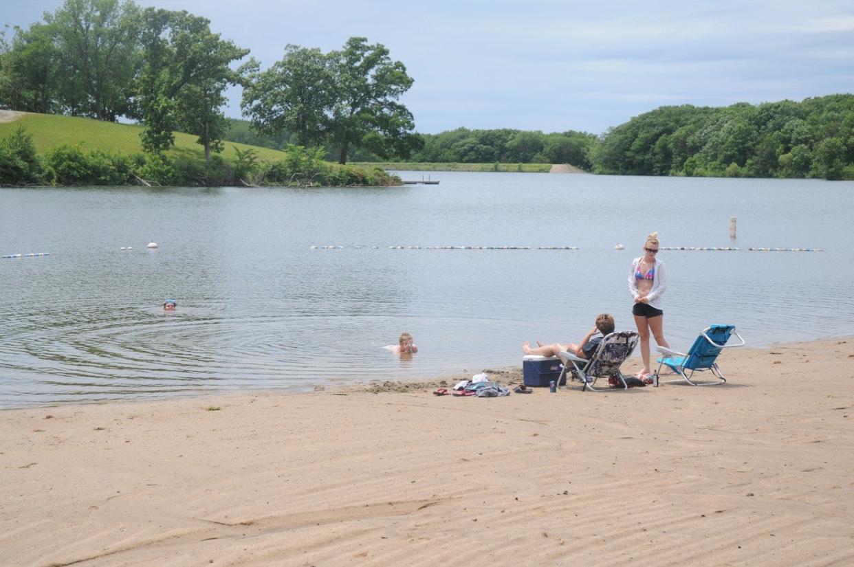 Swimmers enjoy the beach at Nine Eagles State Park in southern Iowa.