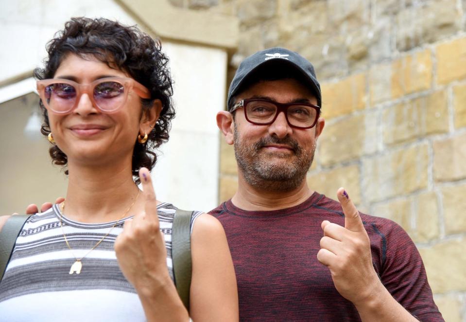 Indian Bollywood actor Aamir Khan (right) with his wife and director Kiran Rao (left) after voting in Mumbai on April 29, 2019 (AFP via Getty Images)