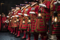 Yeoman warders take part in the traditional Ceremonial Search ceremony ahead of the official State Opening of Parliament in London, Monday Oct. 14, 2019. (Richard Pohle/Pool via AP)