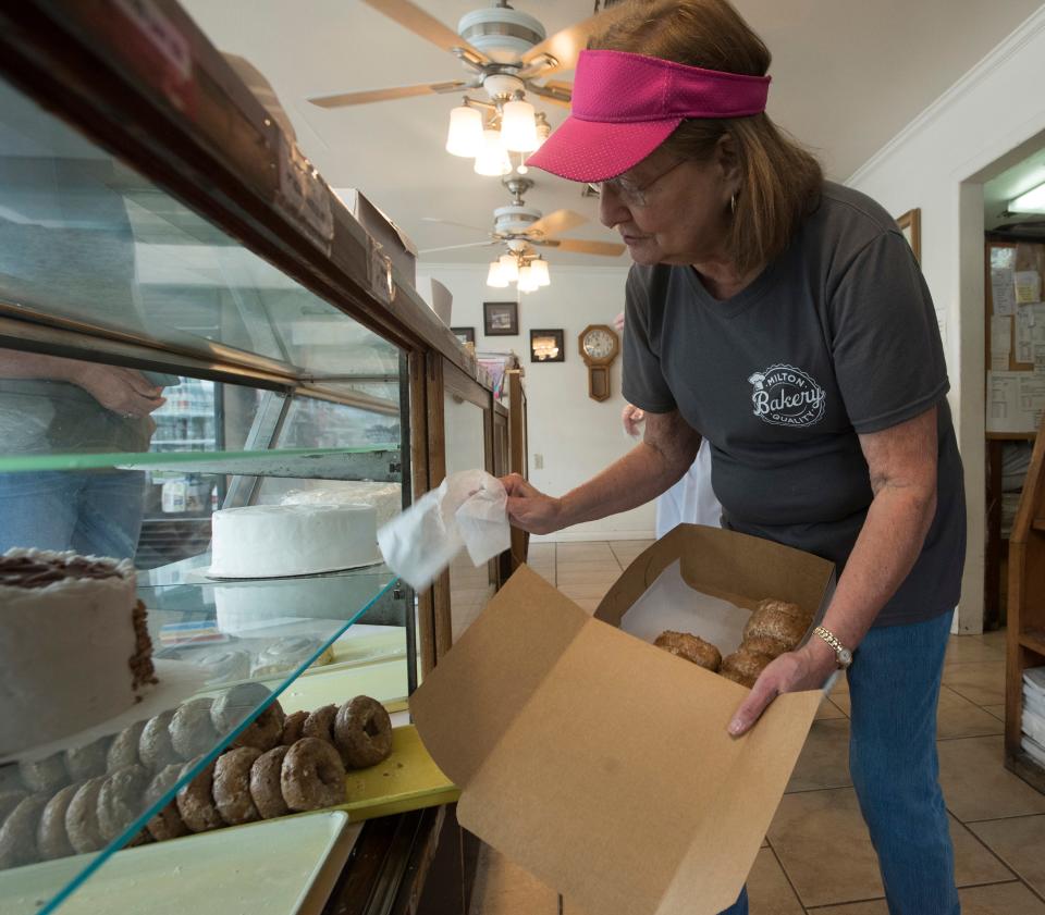 Frances Michener, owner of the Milton Quality Bakery, fills a customers order Sept. 11, 2017. The longtime Milton bakery will reopen Monday.