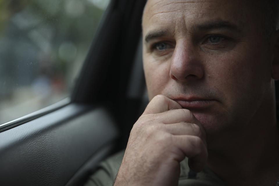 Oleksii Dibrovskyi, a deputy of the Polohy City Council, in Zaporizhzhia region, sits in a car in Krakow, Poland, Tuesday, Aug. 23, 2022. In a deliberate, widespread campaign, Russian forces systematically targeted influential Ukrainians like Dibrovskyi, nationally and locally, to neutralize resistance through detention, torture and executions, an Associated Press investigation has found. (AP Photo/Michal Dyjuk)