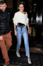 <p>In a ripped cropped Unravel Project knit sweater, black tank top, high-waisted belted jeans, white Doc Marten boots and rounded sunglasses leaving her hotel in Paris.</p>