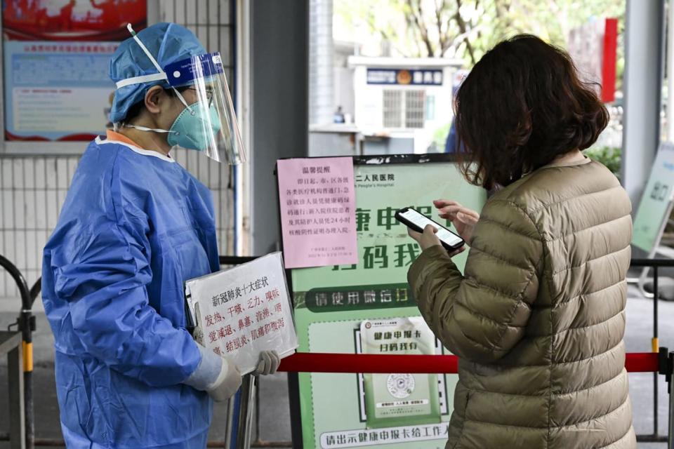 <div class="inline-image__caption"><p>A medical worker checks a citizen's health QR code at the entrance of Guangzhou No.12 People's Hospital on Dec. 3, 2022 in Guangzhou, Guangdong Province of China.</p></div> <div class="inline-image__credit">Chen Jimin/China News Service via Getty Images</div>