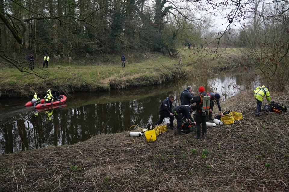 Police prepare to enter the river (PA)