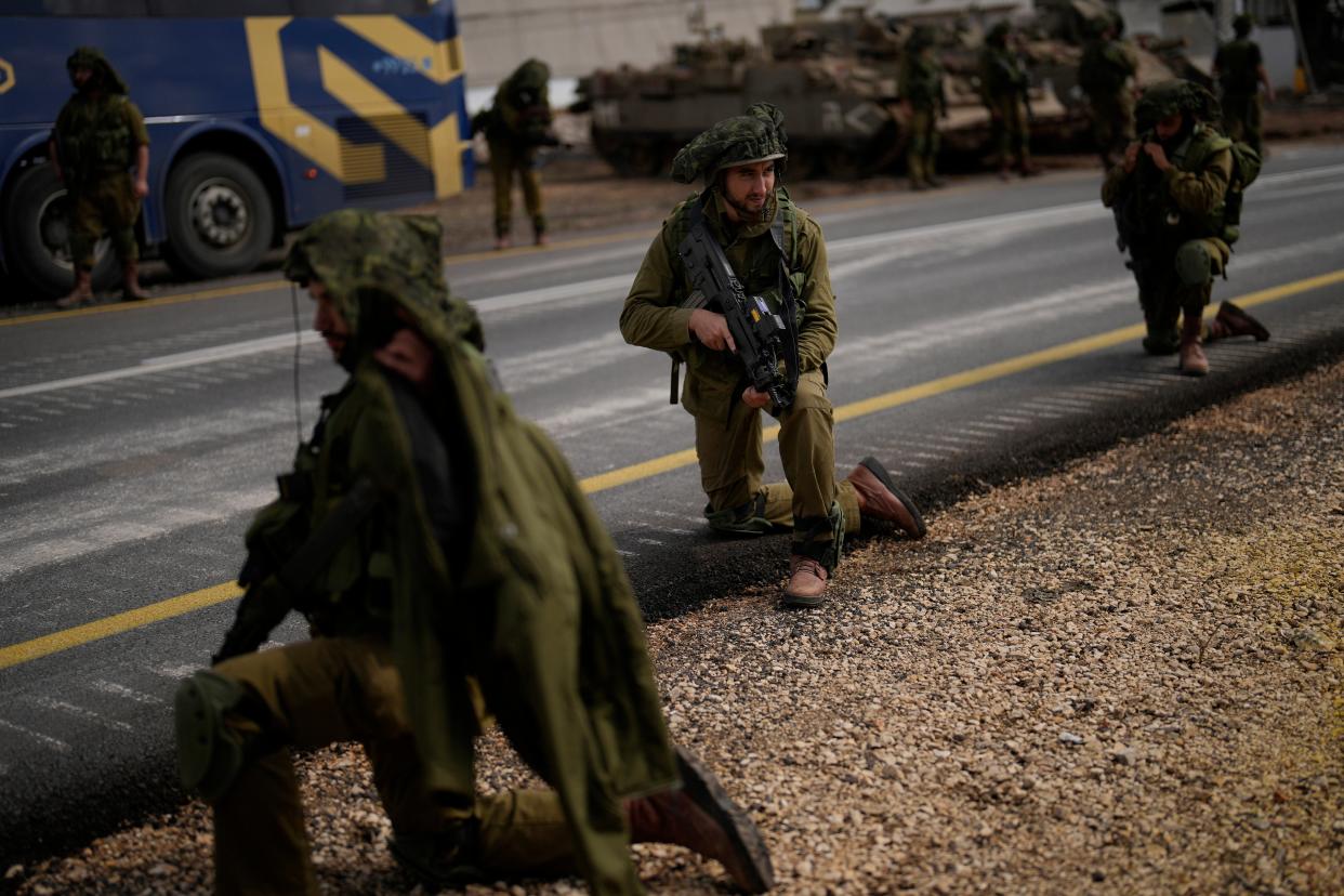 Israeli soldiers patrol along a road near the border between Israel and Lebanon (Copyright 2023 The Associated Press All rights reserved)