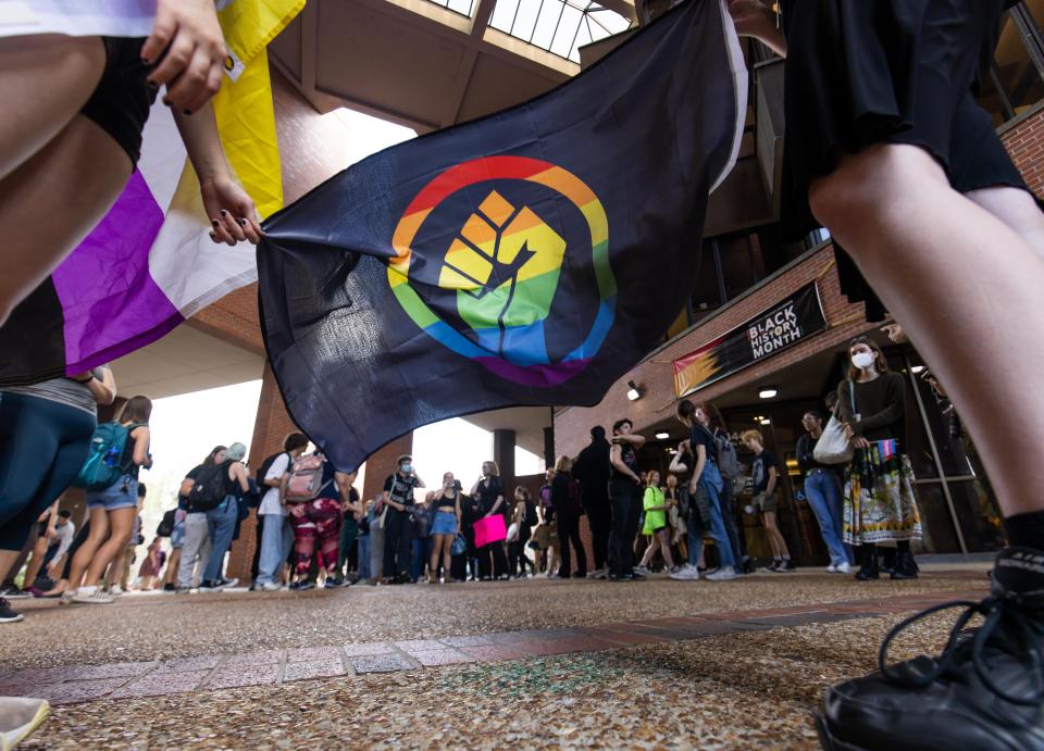 About 100 University of Florida students protest recent education-related efforts by Gov. Ron DeSantis, including his policies targeting LGBTQ+ and people of color on February 23, 2023.