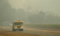 <p>A fire truck makes its way through the Chateau St. Jean winery, Tuesday, Oct. 10, 2017, in Kenwood, Calif. (Photo: Eric Risberg/AP) </p>