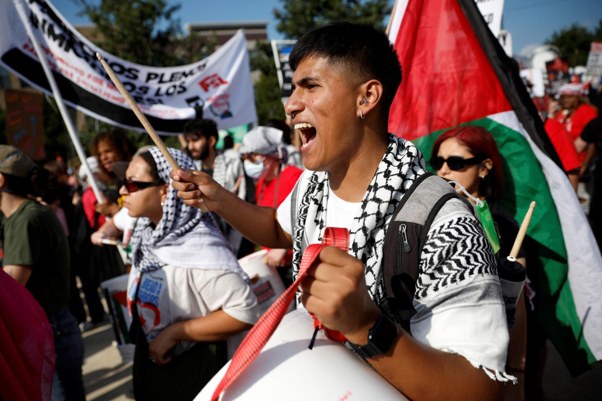 People attend a rally ahead of the DNC.