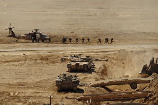 Israeli soldiers deploy from a Blackhawk helicopter during a military exercise at Shizafon army base in the Negev Desert in 2010. Israel and the United States have agreed to postpone a major military defence exercise scheduled for spring, Israeli public radio reported, amid rising regional tension over Iran's nuclear programme