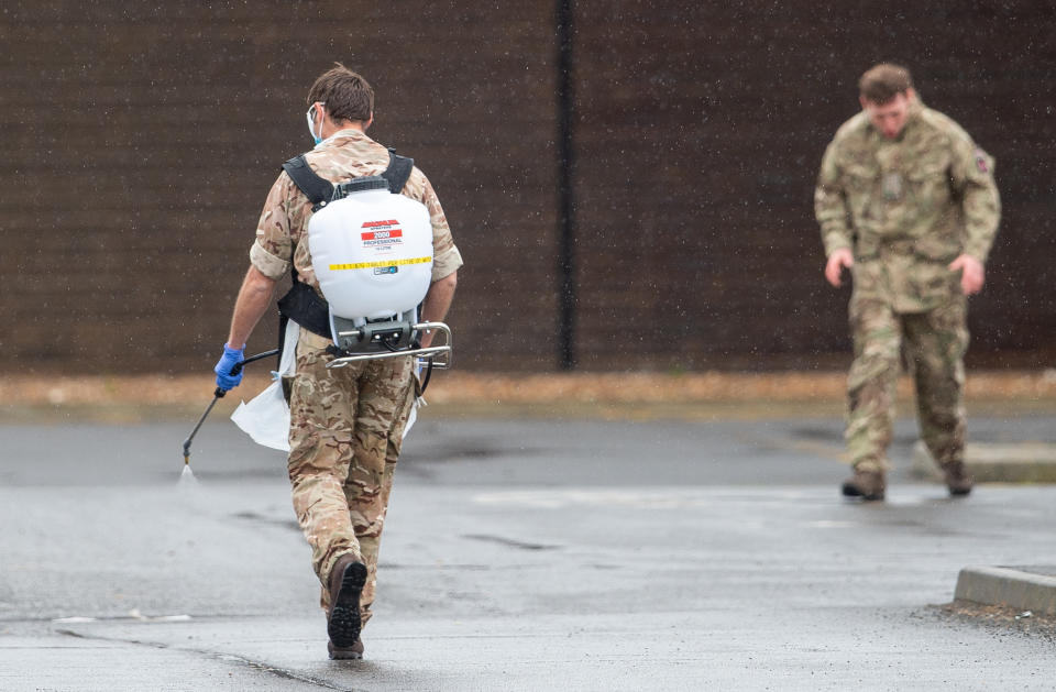 A member of the military sprays disinfectant at a Covid-19 testing centre in Boston, Lincolnshire, as the UK continues in lockdown to help curb the spread of the coronavirus.