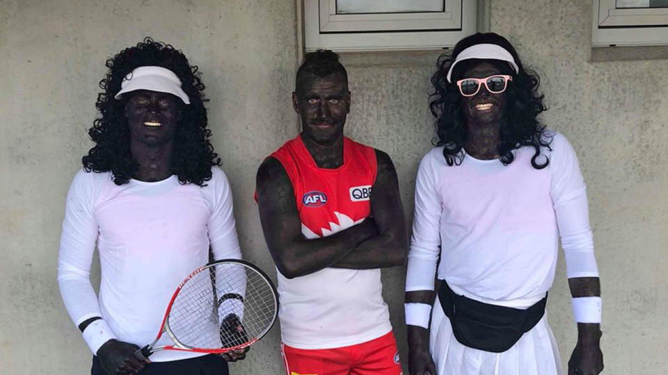 The three Tasmanian Penguin Football Club players in their blackface makeup. (Photo: Beau Grundy)