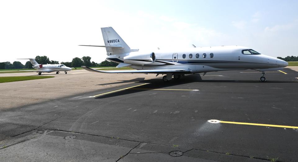 Two corporate jets at the Branch County Memorial Airport terminal Thursday morning.