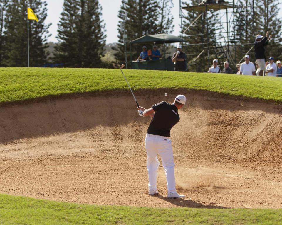 Webb Simpson hits out of a bunker on the second green during the final round of the Tournament of Champions golf tournament, Monday, Jan. 6, 2014, in Kapalua, Hawaii. (AP Photo/Marco Garcia)