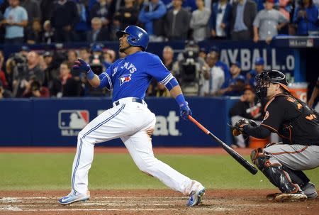 Toronto Blue Jays first baseman Edwin Encarnacion (10) hits a walk off three run home run against Baltimore Orioles to give the Jays a 5-2 win in the American League wild card playoff baseball game at Rogers Centre. Mandatory Credit: Dan Hamilton-USA TODAY Sports