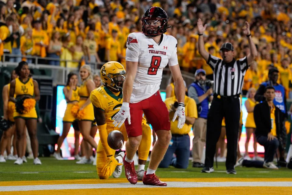 Texas Tech wide receiver Coy Eakin (8) celebrates after catching a 13-yard touchdown pass in the first quarter of the Red Raiders' 39-14 victory against Baylor on Saturday night in Waco. It was the second career catch and first touchdown for Eakin, a redshirt freshman from Stephenville.